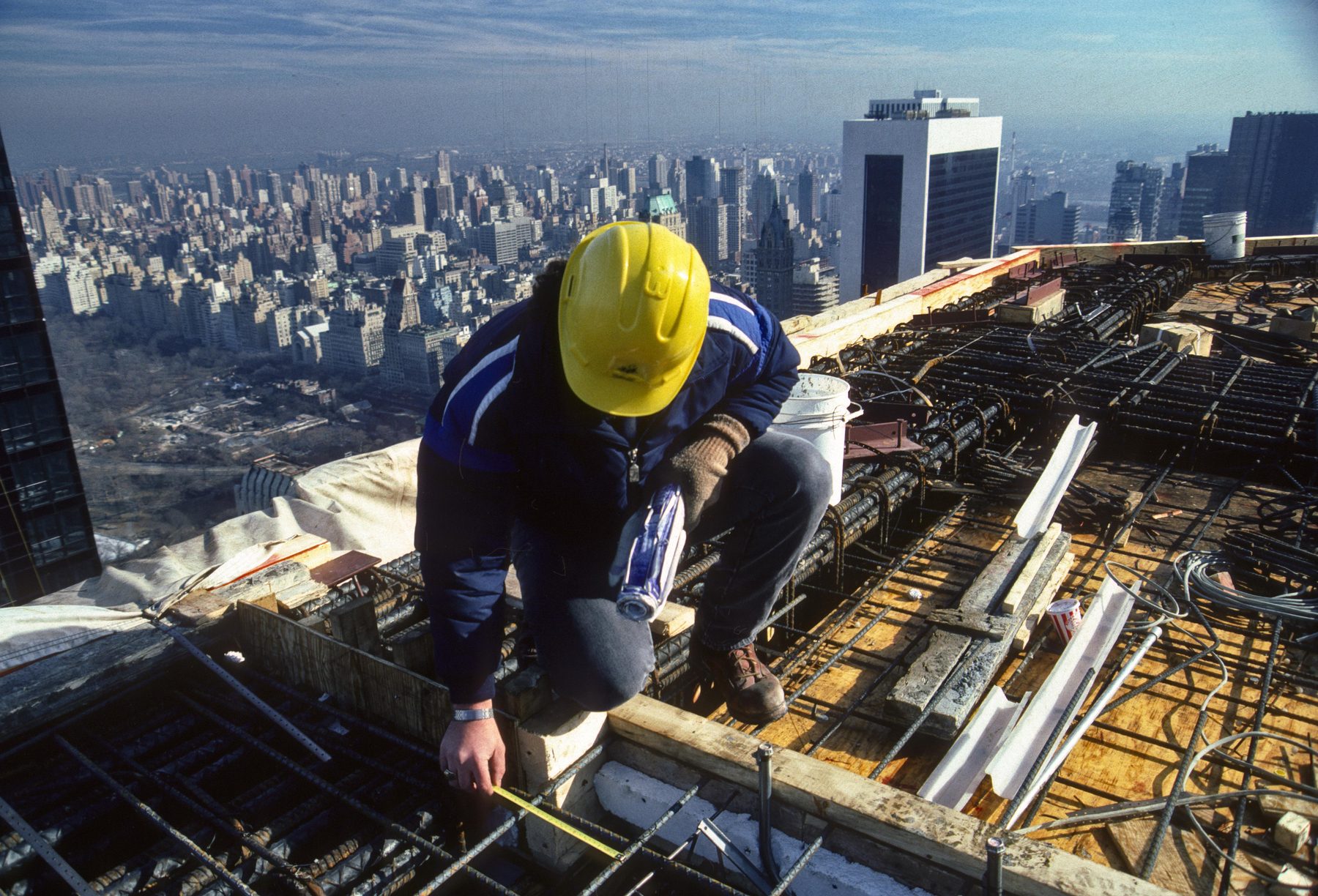 Ironworker on a high-rise construction site overlooking New York City
