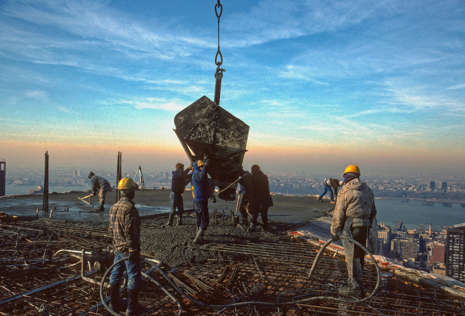 Concrete pour on a high-rise construction site at dawn, New York City