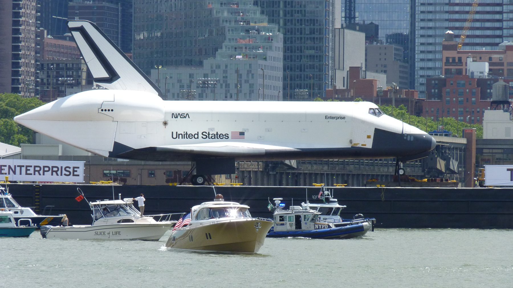 Space Shuttle Enterprise on its barge passing the Manhattan skyline, June 2012