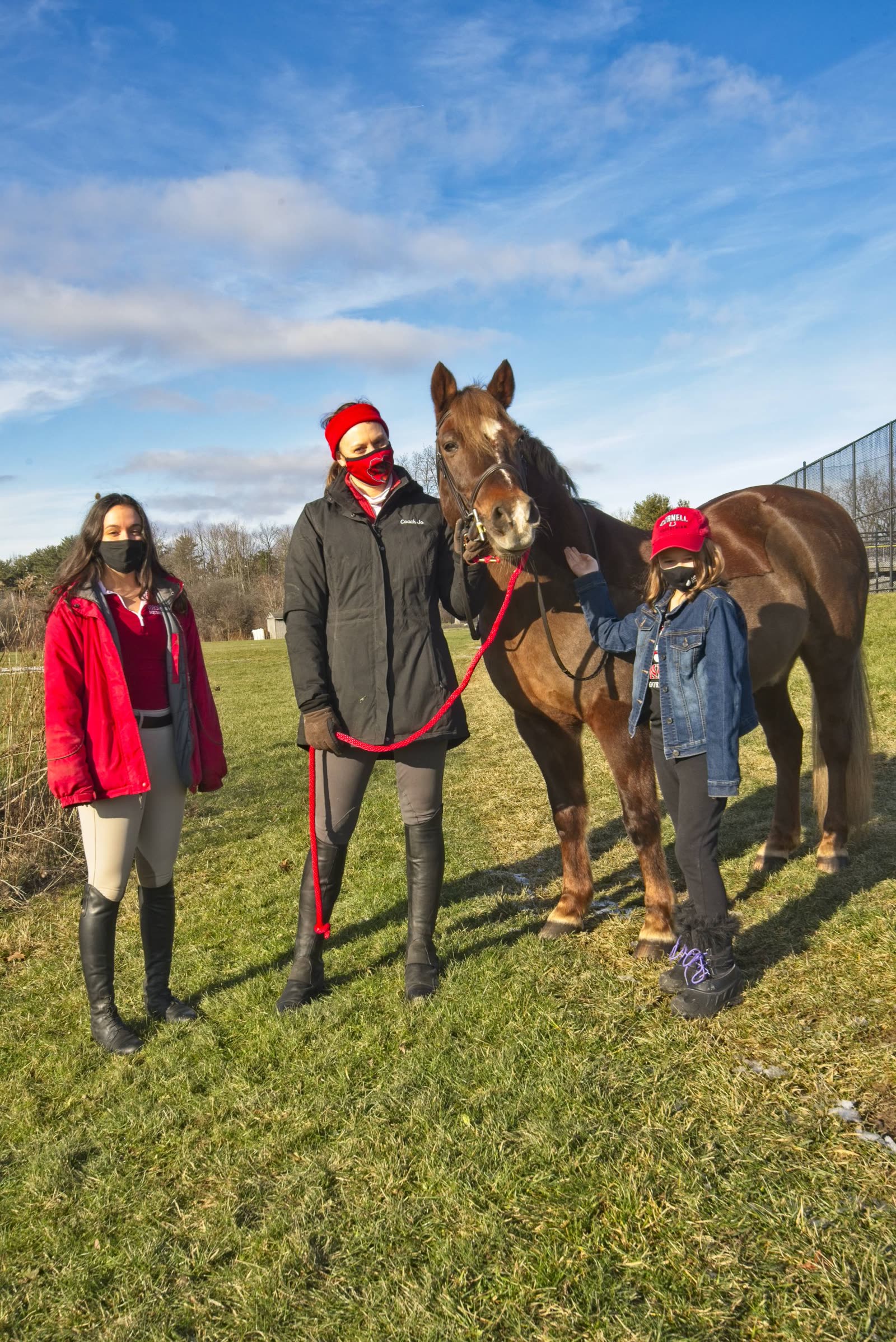 Maeve with her mother, a teammate, and the Cornell Equestrian head coach, masked during the first session