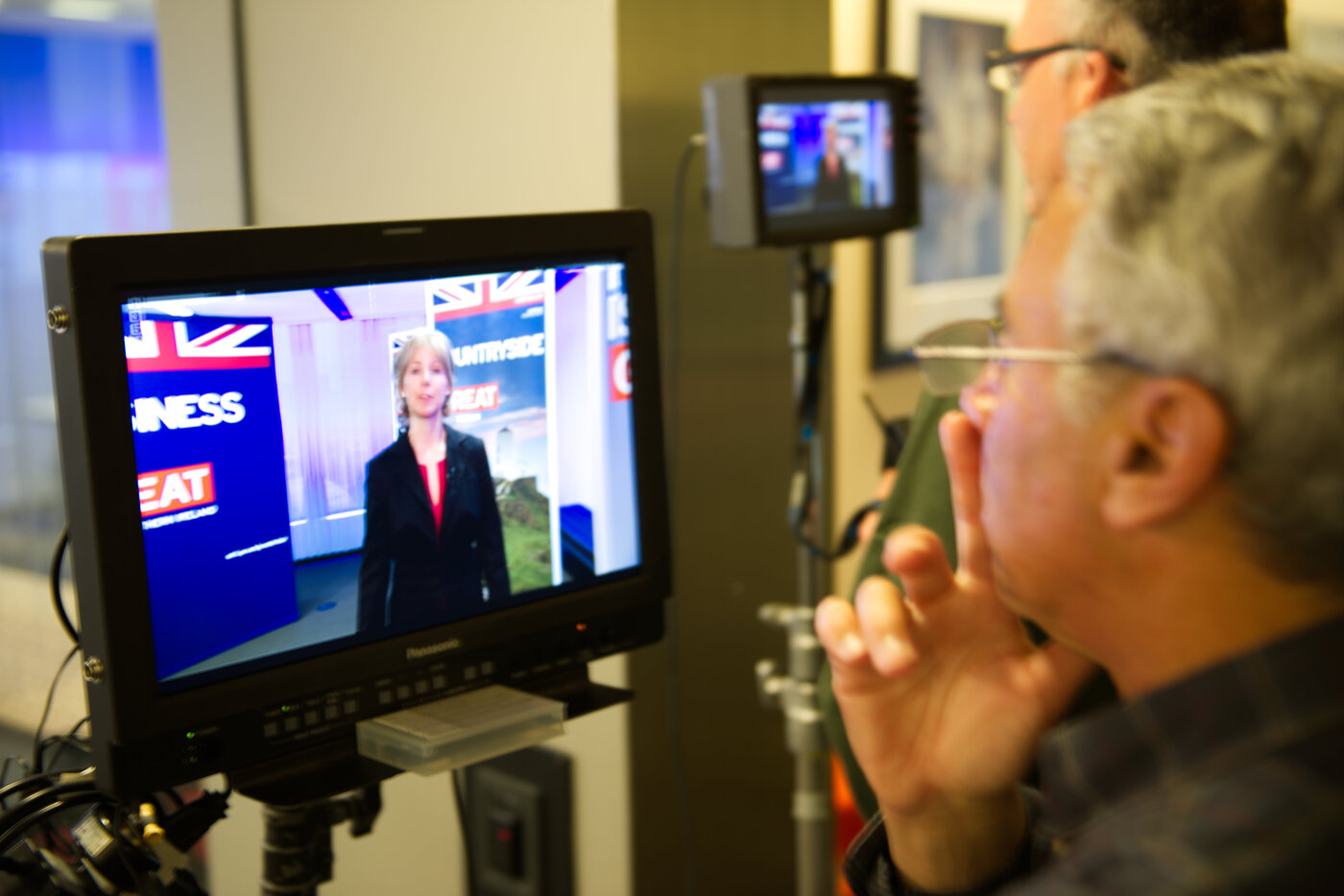 Camera operator monitoring a shot on set